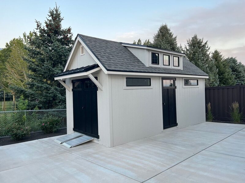 10x12 Orchard style shed by Wright's Shed Co. with gray LP SmartSide siding, white trim, black steel-framed double doors and architectural shingles